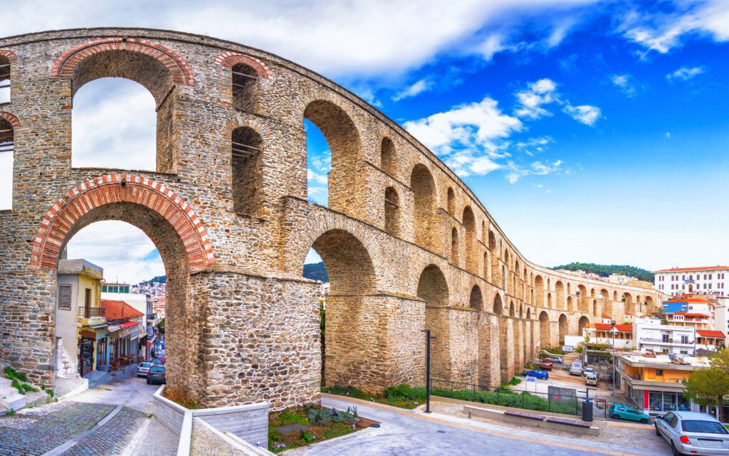 cityscape with medieval aqueduct kamares in the kavala city, macedonia, greece.