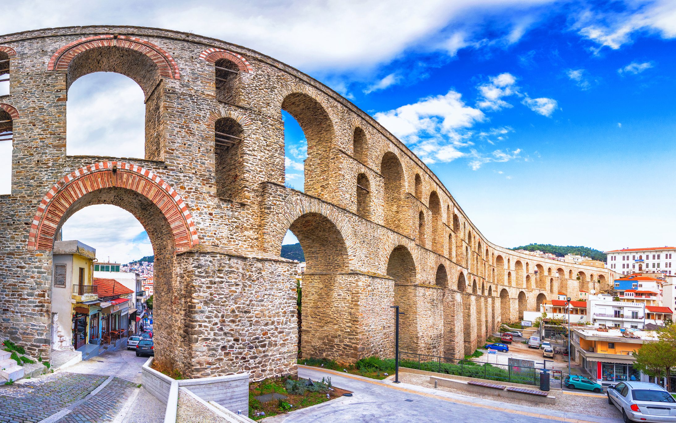 cityscape with medieval aqueduct kamares in the kavala city, macedonia, greece.
